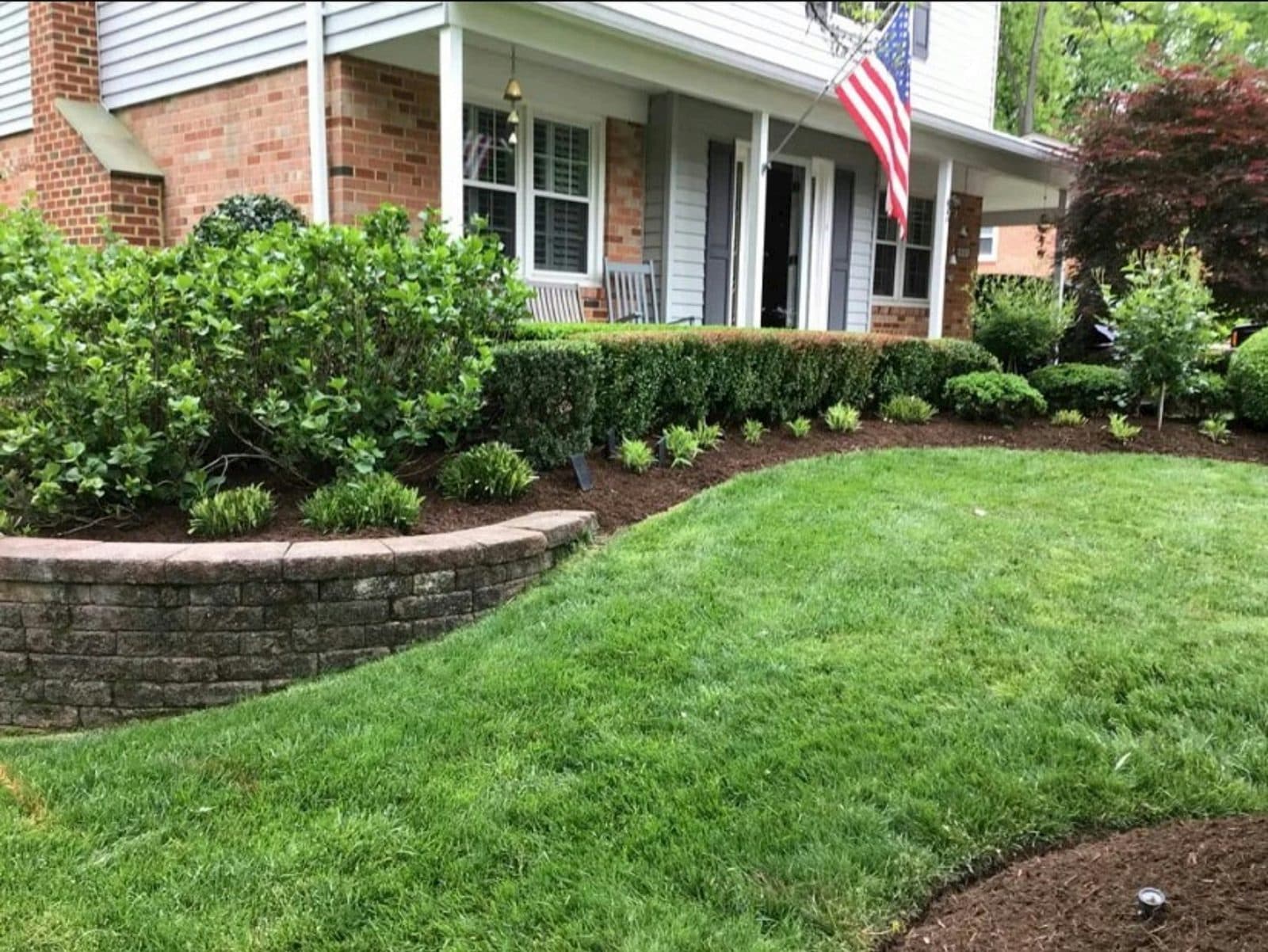 Freshly mowed lawn with sharp edges in front of a coastal home in Surf City NC